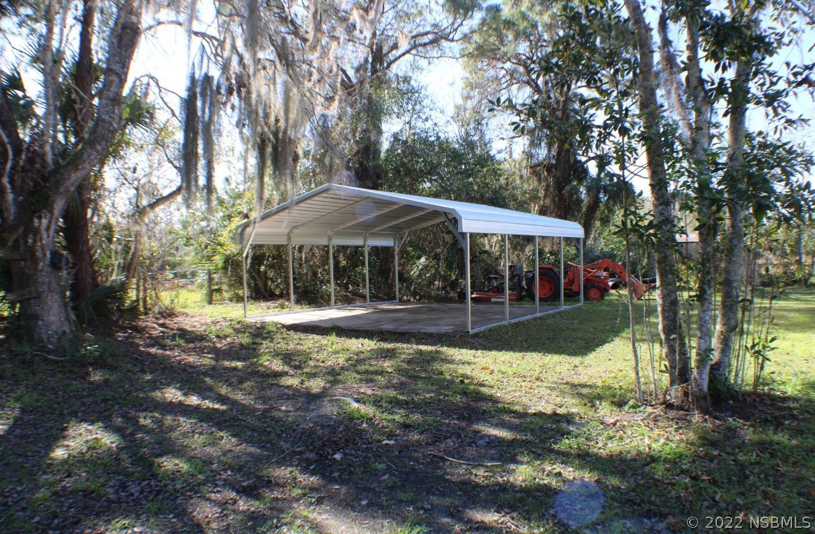 Undisclosed Address Edgewater, FL 32141 - Photo 32 of 37 a view of a house with yard and sitting area