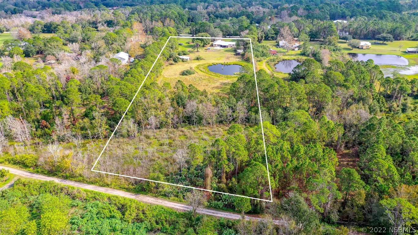 Undisclosed Address Edgewater, FL 32141 - Photo 33 of 37 a view of a yard and swimming pool