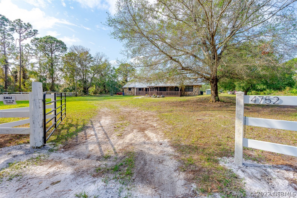 Undisclosed Address Edgewater, FL 32141 - Photo 4 of 37 a view of a swimming pool with an outdoor space and seating area