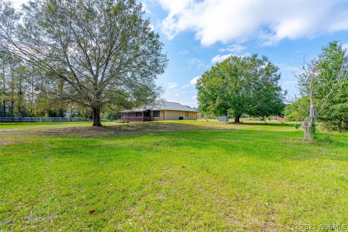 Undisclosed Address Edgewater, FL 32141 - Photo 6 of 37 a view of a house with a big yard
