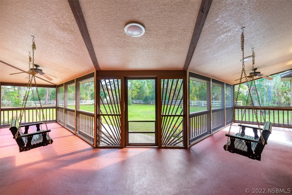 Undisclosed Address Edgewater, FL 32141 - Photo 7 of 37 en empty room with sliding door and balcony