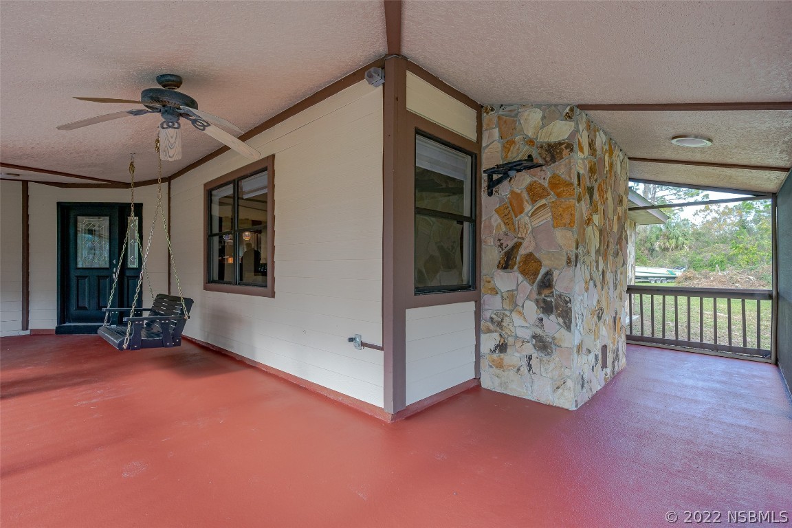 Undisclosed Address Edgewater, FL 32141 - Photo 9 of 37 a view of livingroom with furniture and floor to ceiling window
