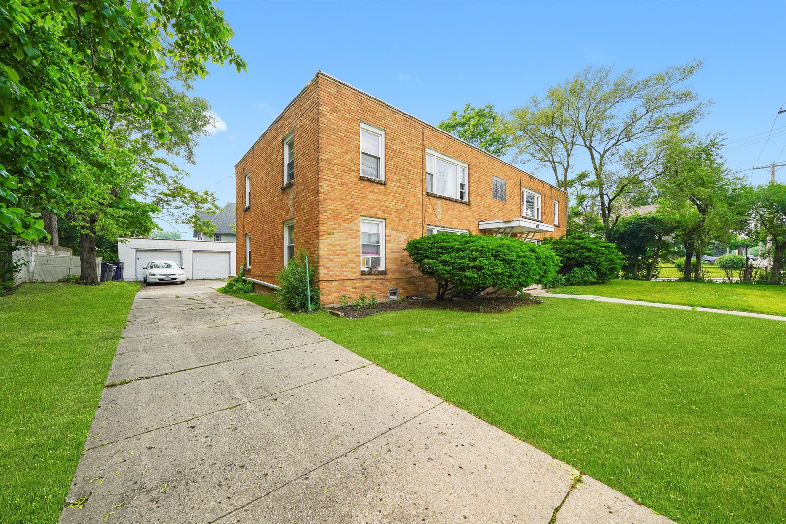 420 Prospect Boulevard, Unit 1N Elgin, IL 60120 - Photo 13 of 16 a front view of a house with a yard