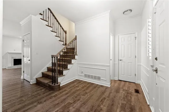 a view of entryway with wooden floor
