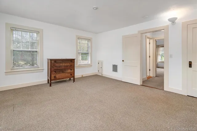 a view of a livingroom with furniture and windows