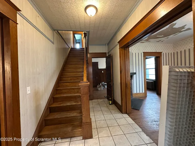 a view of a livingroom with furniture and a window