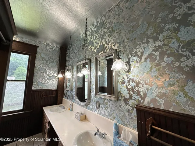 a bathroom with a sink and mirror