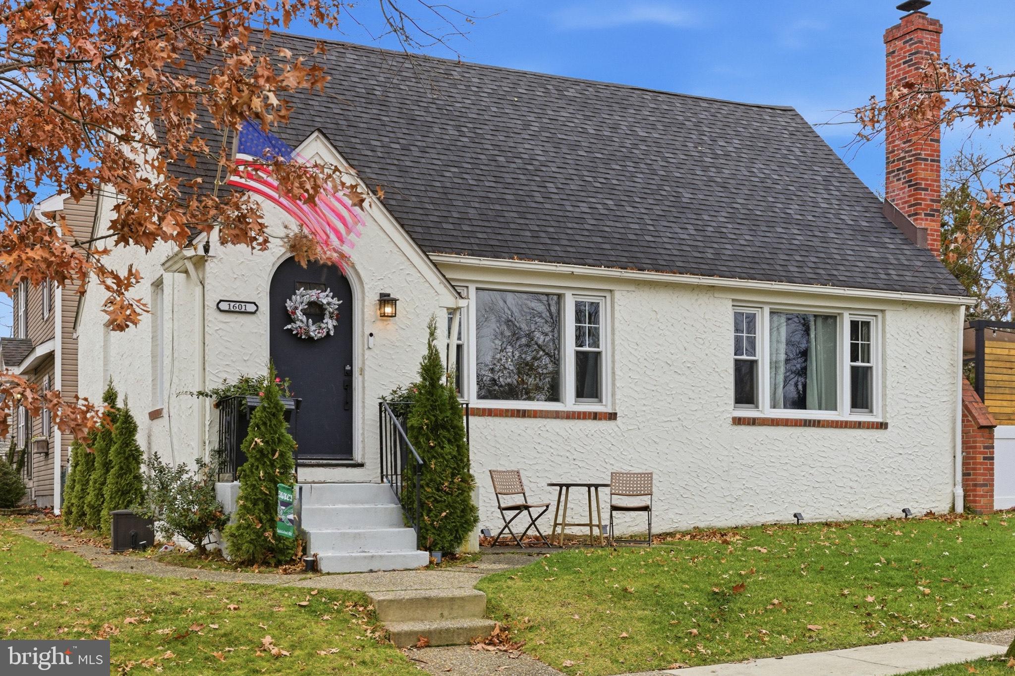 a view of house with yard