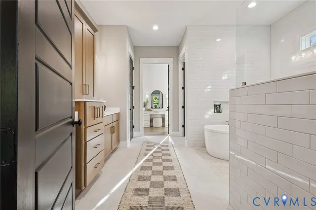 a bathroom with a bathtub and a shower