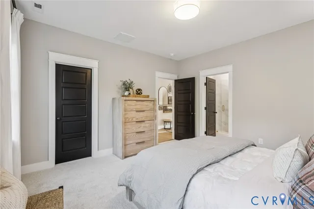 a bedroom with a bed and a closet