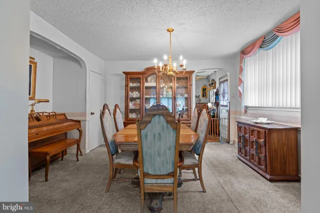 a kitchen that has a cabinets and a chair in it
