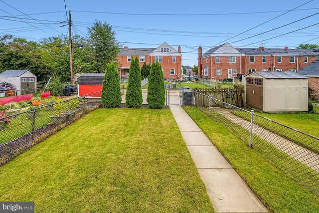 a view of swimming pool with a patio and a yard