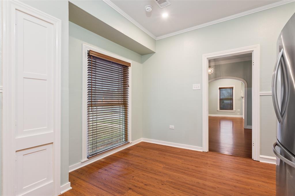 2600 Maple Avenue Waco, TX 76707 - Photo 15 of 28 a view of an empty room with wooden floor and a window