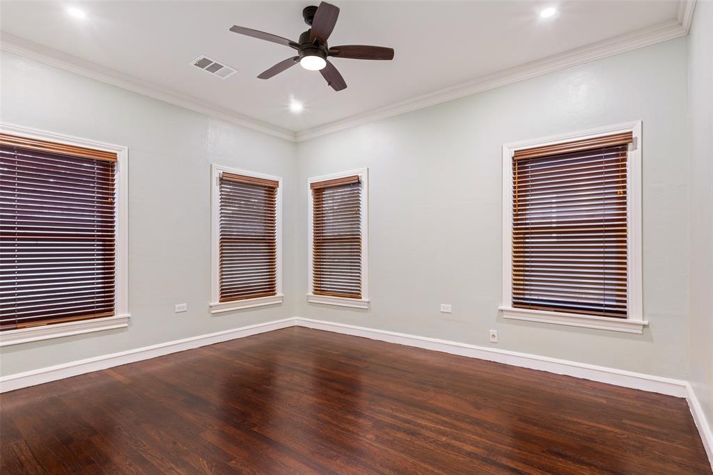 2600 Maple Avenue Waco, TX 76707 - Photo 19 of 28 a view of an empty room with wooden floor and a window