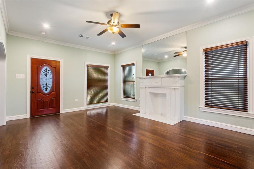 2600 Maple Avenue Waco, TX 76707 - Photo 9 of 28 a view of an empty room with window and wooden floor