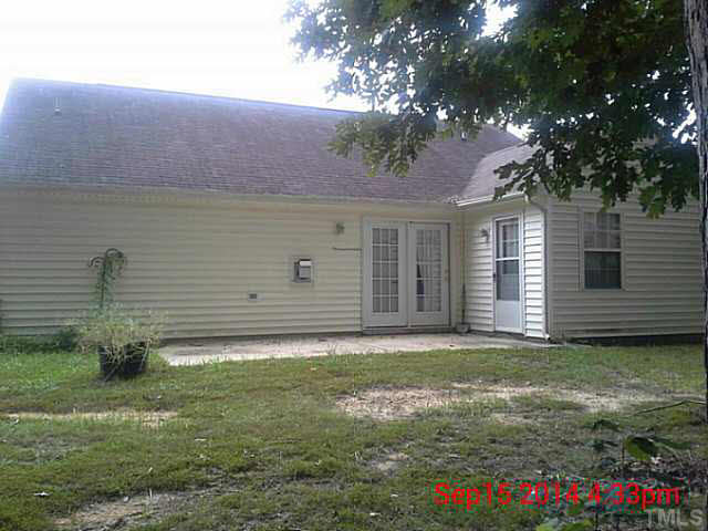 3117 Mango Drive Raleigh, NC 27610 - Photo 4 of 6 a backyard of a house