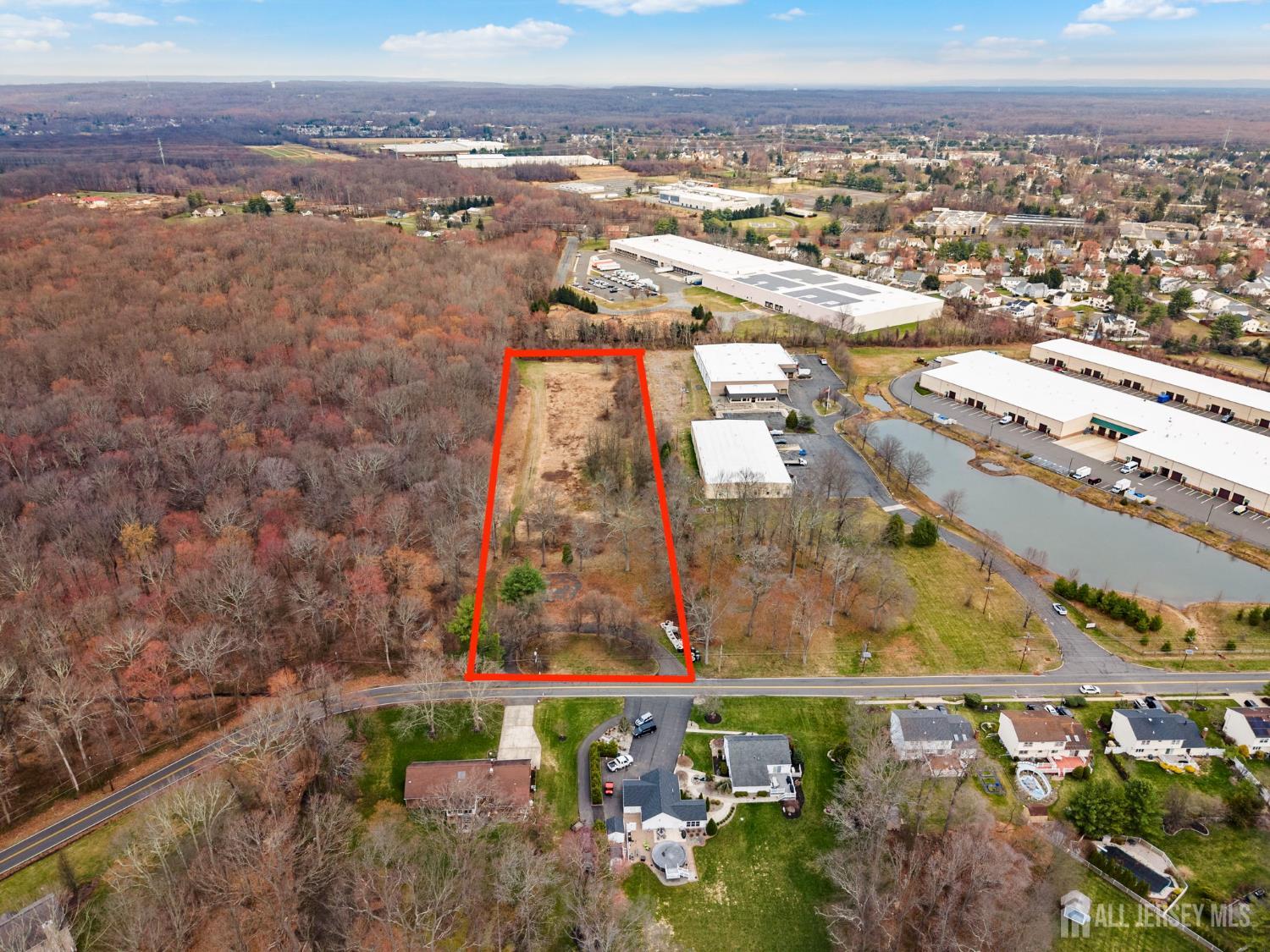 36 Haypress Road Cranbury, NJ 08512 - Photo 3 of 11 an aerial view of residential building and lake
