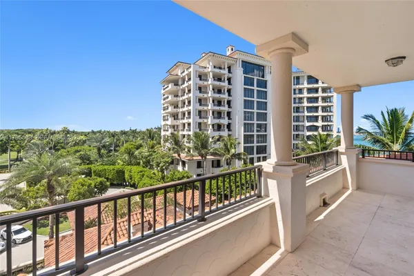 a view of a chairs and table in a living room