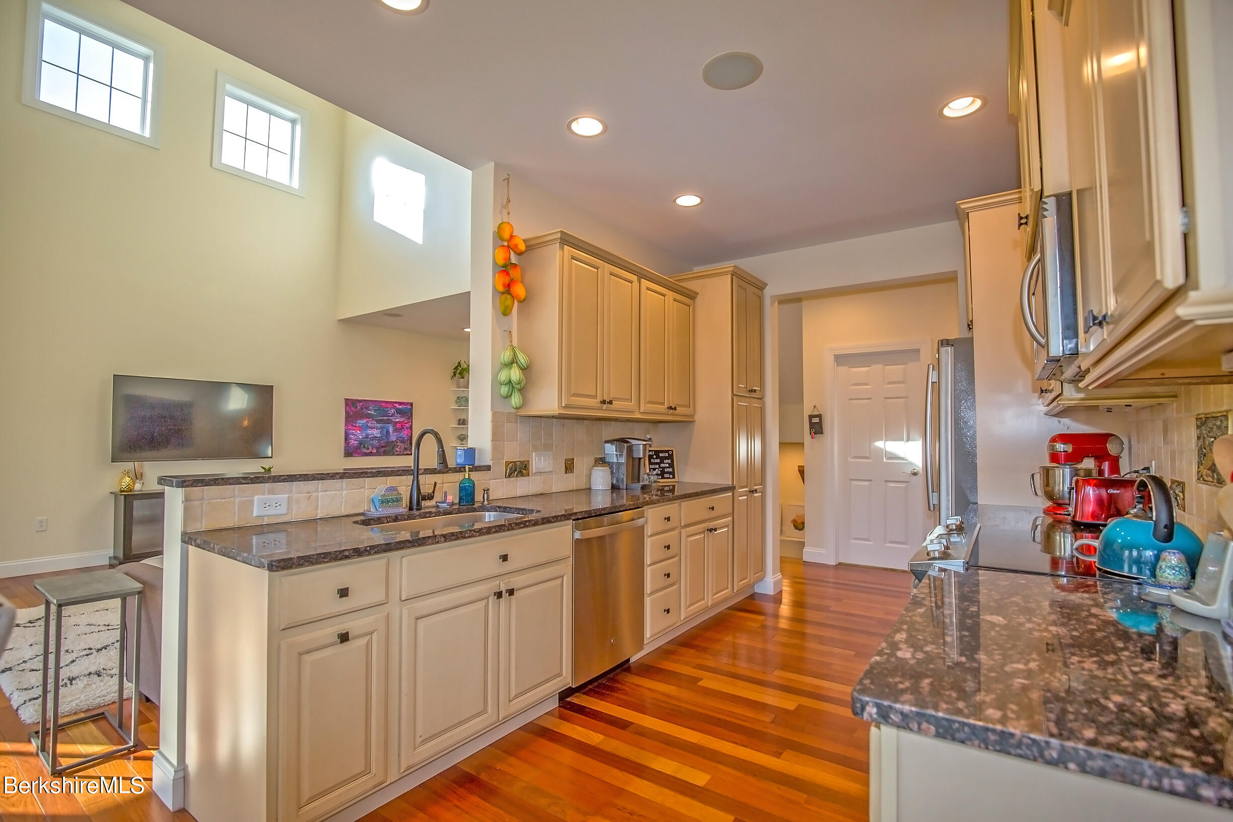 77 Alpine Trail Pittsfield, MA 01201 - Photo 13 of 58 a kitchen with stainless steel appliances granite countertop a sink and cabinets
