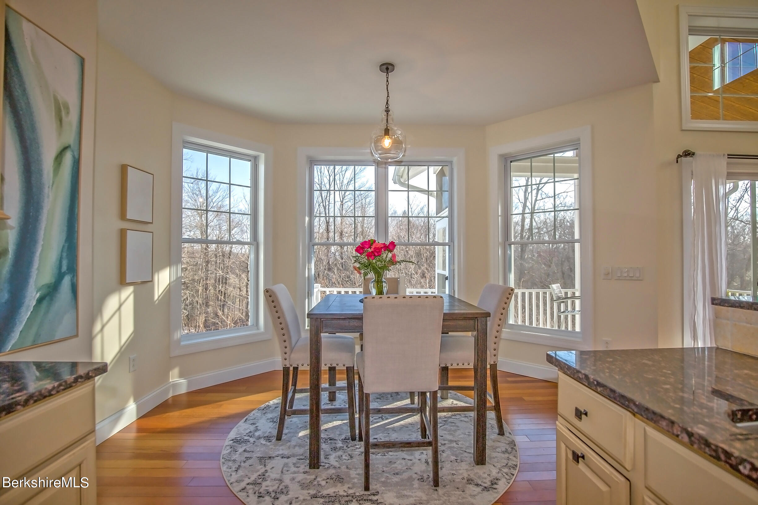 77 Alpine Trail Pittsfield, MA 01201 - Photo 15 of 58 a dining room with furniture wooden floor and a chandelier