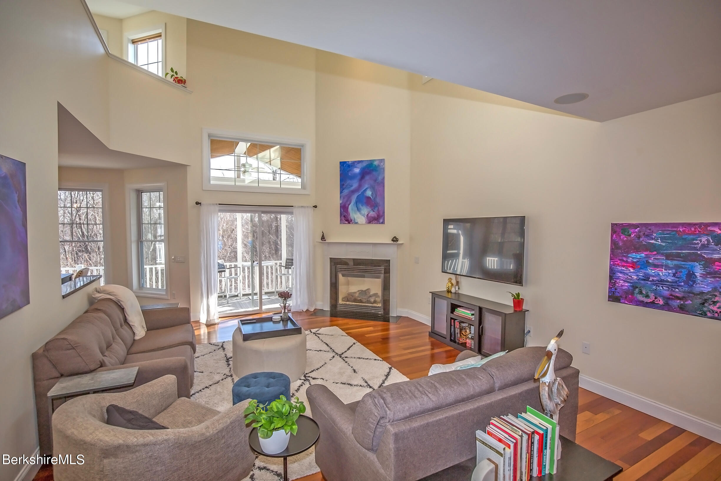 77 Alpine Trail Pittsfield, MA 01201 - Photo 41 of 58 a living room with furniture a fireplace and a large window
