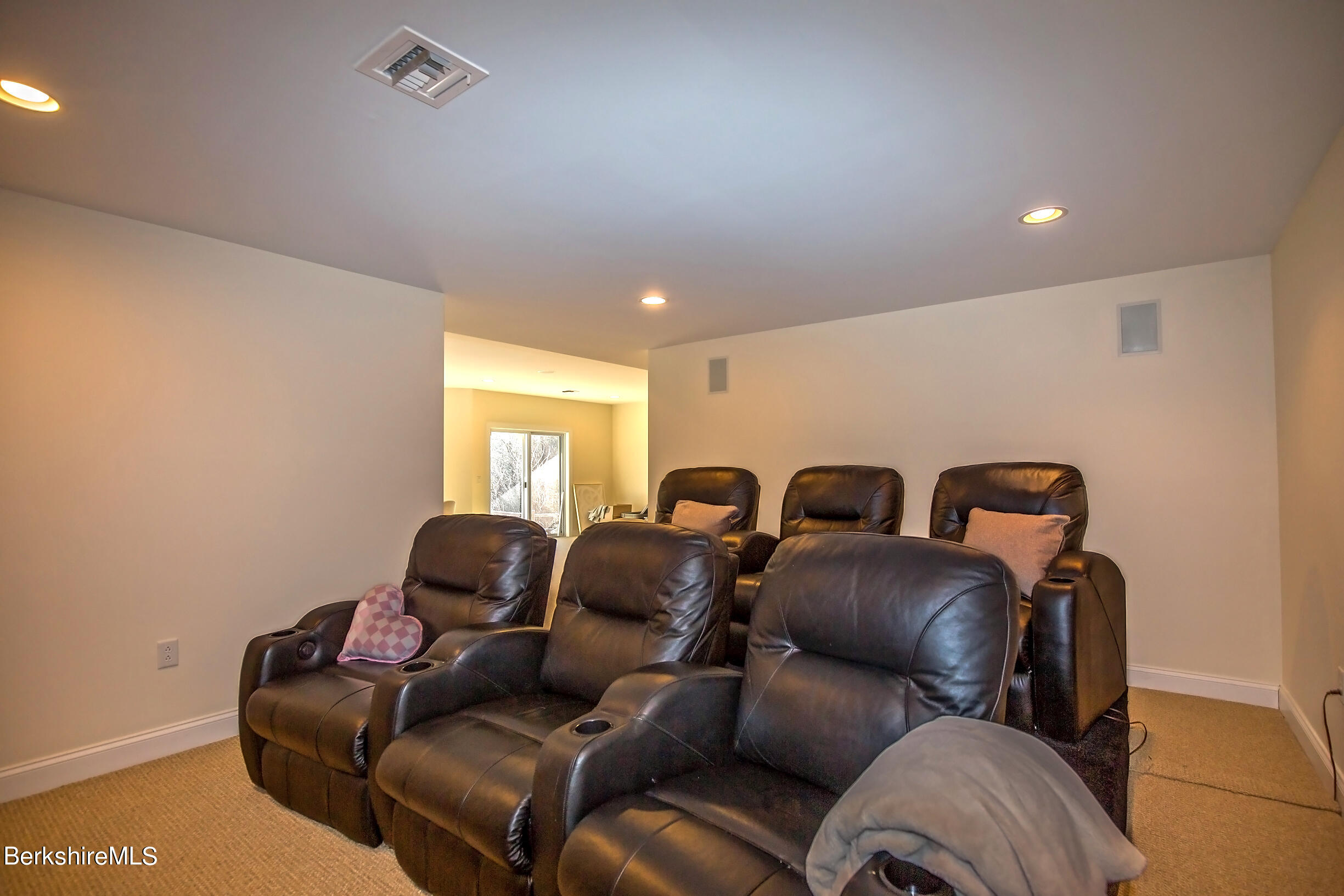 77 Alpine Trail Pittsfield, MA 01201 - Photo 48 of 58 a media room with lots of chairs and a projector screen