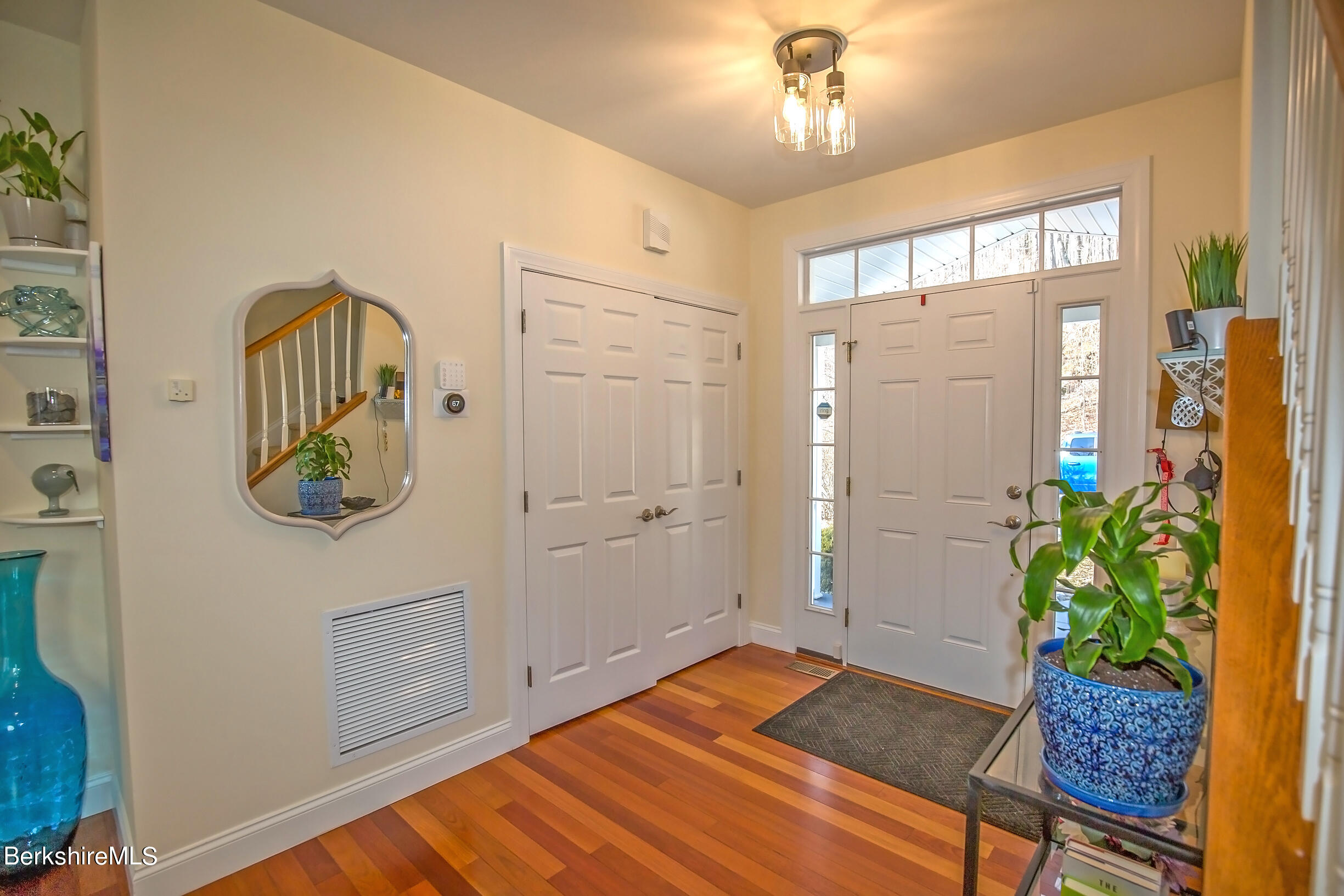 77 Alpine Trail Pittsfield, MA 01201 - Photo 5 of 58 a bedroom with a bed and a chandelier fan