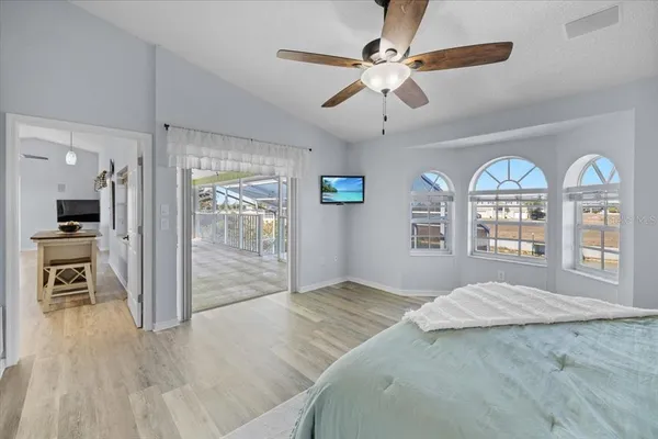 a bedroom with a bed and a table