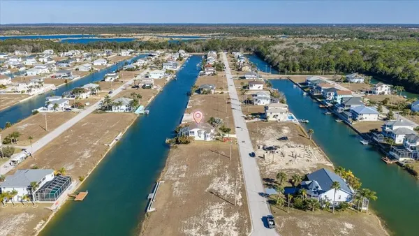 an aerial view of a house with a lake view