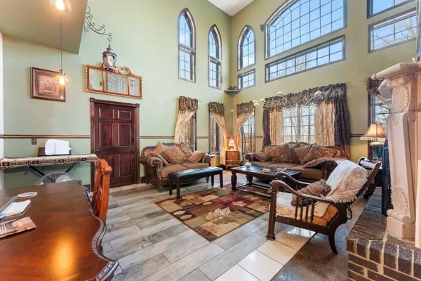 a kitchen with stainless steel appliances granite countertop a sink a stove and a refrigerator