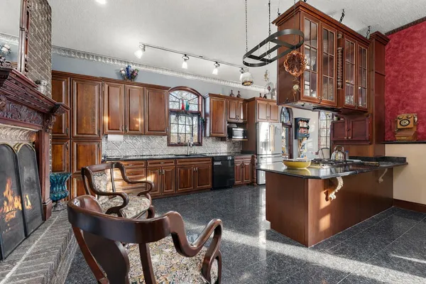 a living room with lots of furniture and gym equipment