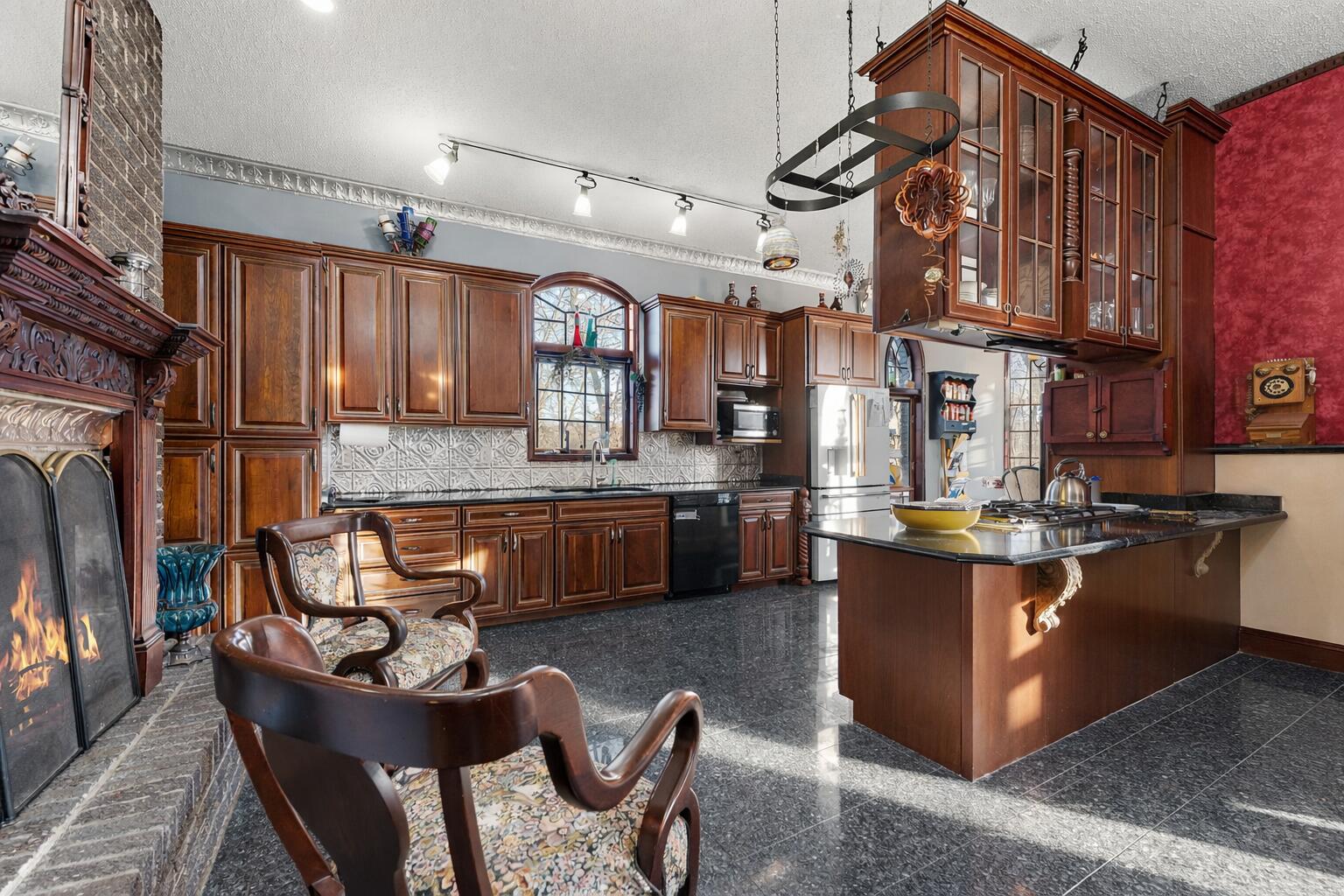 3115 West 800th Street North Rensselaer, IN 47978 - Photo 16 of 36 a kitchen with stainless steel appliances granite countertop a sink a stove and a refrigerator