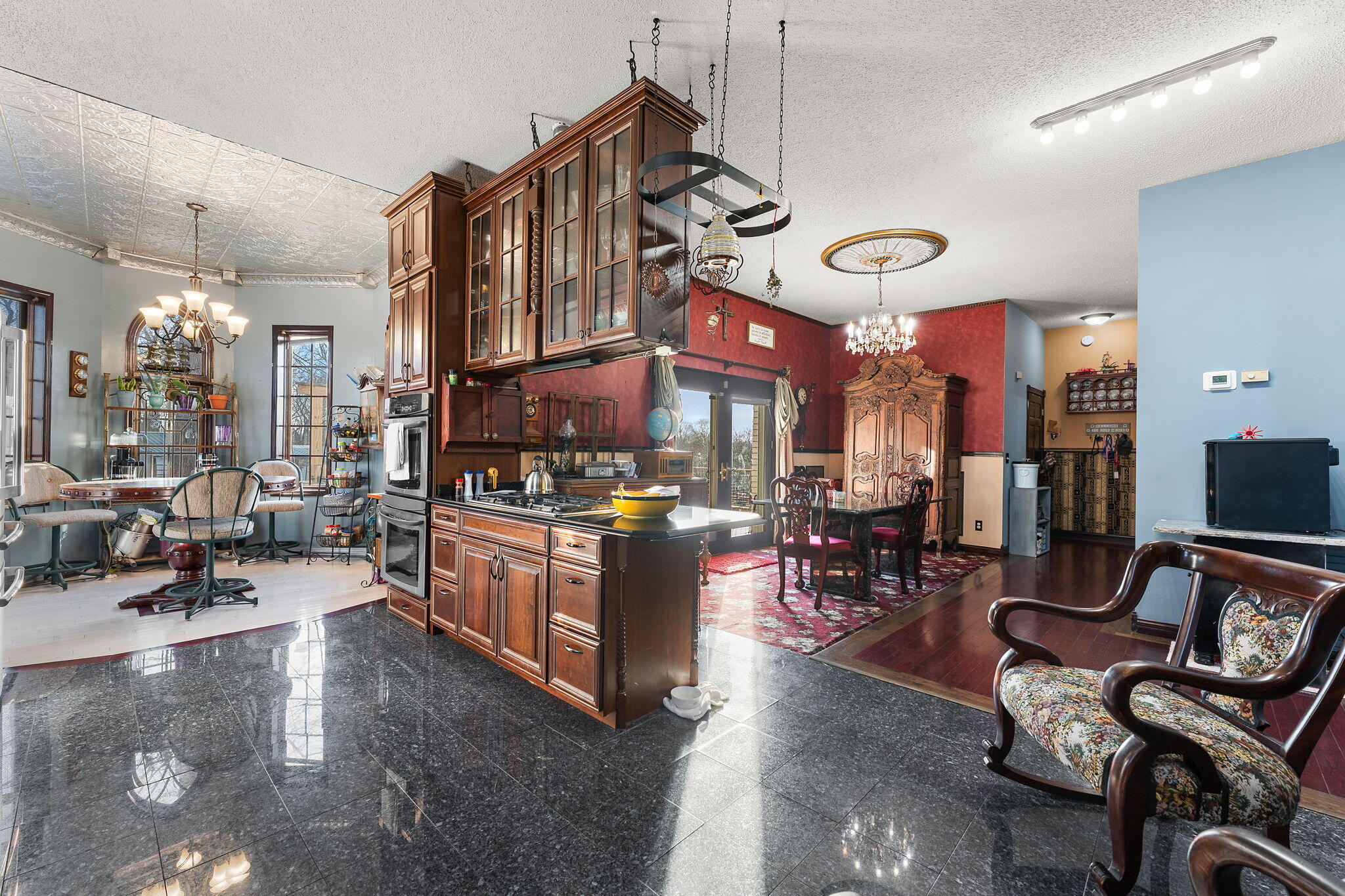 3115 West 800th Street North Rensselaer, IN 47978 - Photo 17 of 36 a living room with lots of furniture and gym equipment