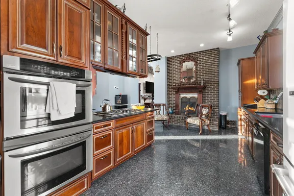 a view of a dining room with furniture wooden floor and a chandelier