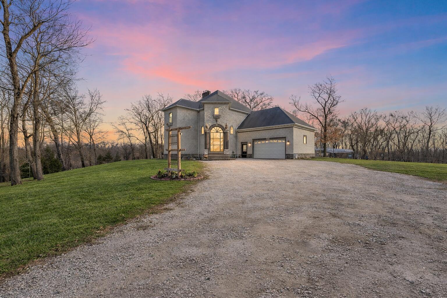 3115 West 800th Street North Rensselaer, IN 47978 - Photo 2 of 36 a front view of a house with a yard and garage