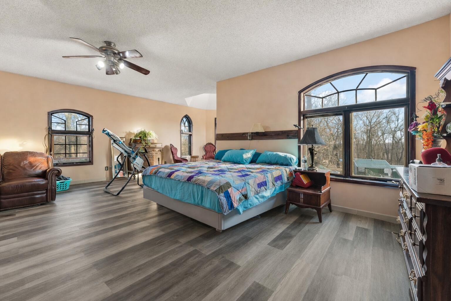 3115 West 800th Street North Rensselaer, IN 47978 - Photo 22 of 36 a bedroom with a bed a large window with table and chairs
