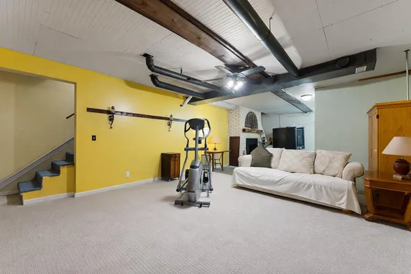 a bathroom with a toilet and a shower curtain
