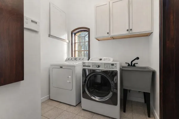 a kitchen with sink cabinets and window