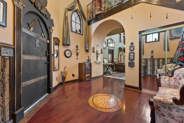 a view of living room with furniture and wooden floor