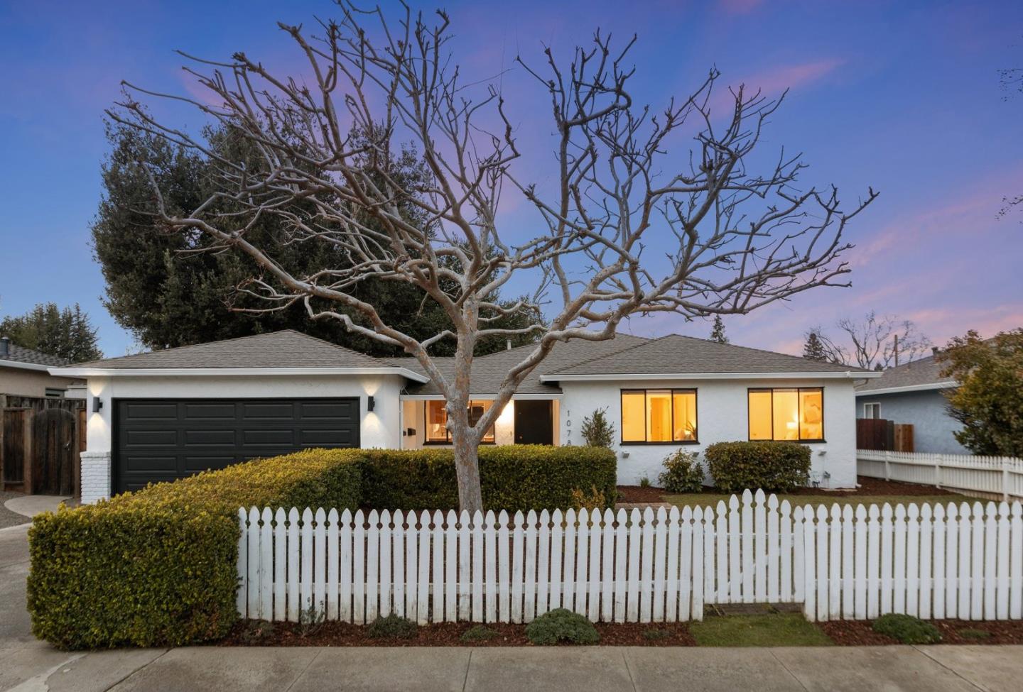 1078 Clark Avenue Mountain View, CA 94040 - Photo 1 of 1 a front view of a house with a yard