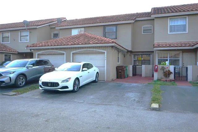 a car parked in front of a house