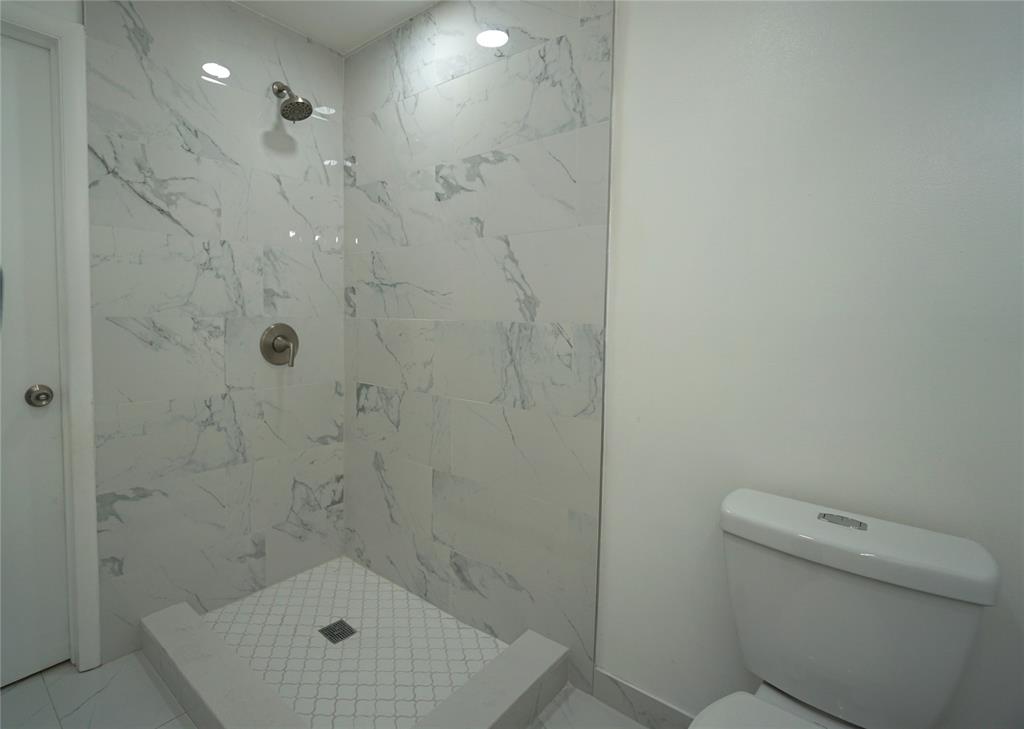 6380 West 24th Court Hialeah, FL 33016 - Photo 13 of 41 a bathroom with a shower and toilet