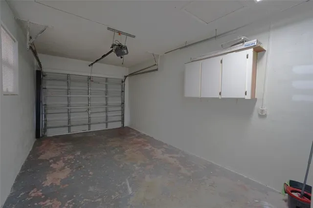 a living room with furniture windows and a flat screen tv