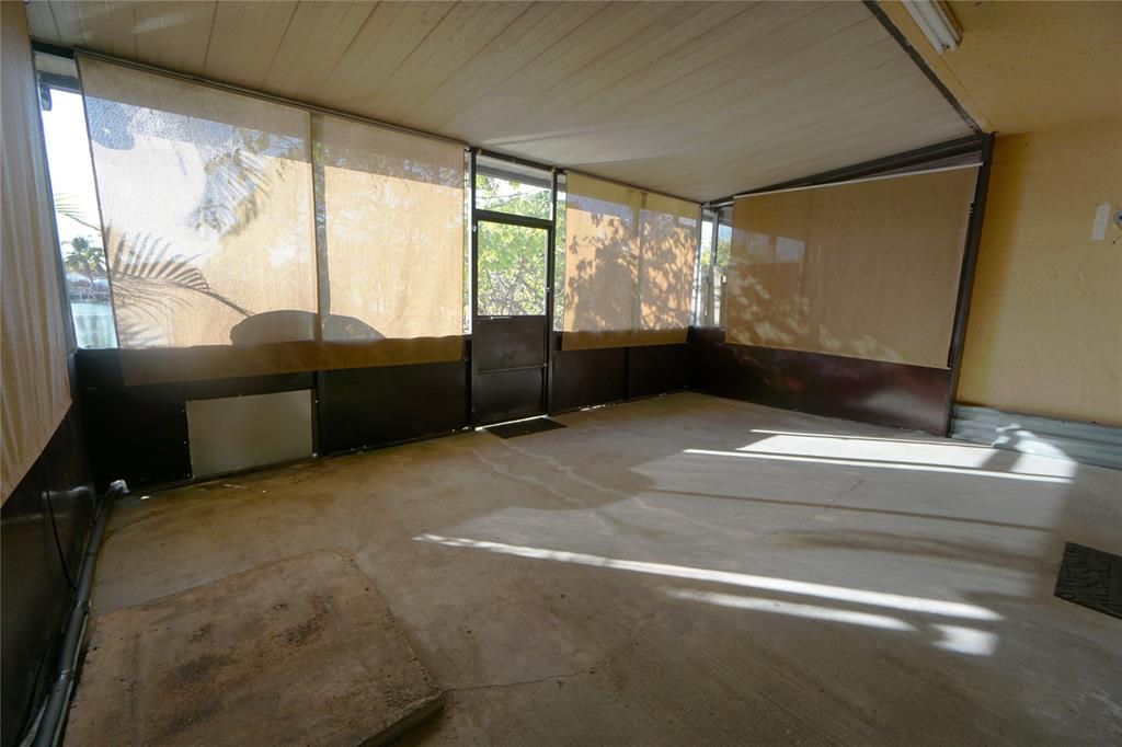 6380 West 24th Court Hialeah, FL 33016 - Photo 17 of 41 a living room with furniture windows and a flat screen tv