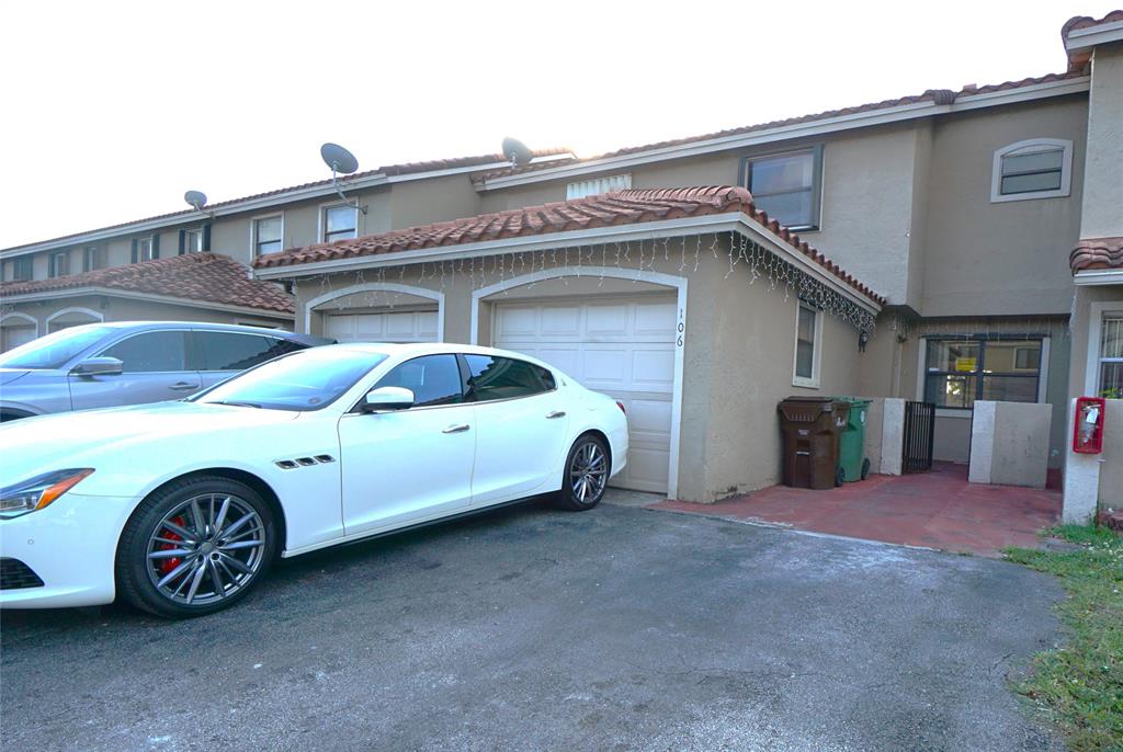 6380 West 24th Court Hialeah, FL 33016 - Photo 2 of 41 a view of a car garage of the house