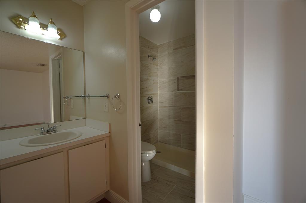 6380 West 24th Court Hialeah, FL 33016 - Photo 32 of 41 a bathroom with a double vanity sink and a mirror