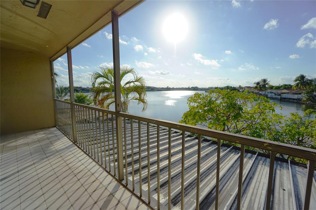 6380 West 24th Court Hialeah, FL 33016 - Photo 39 of 41 a view of balcony with floor to ceiling windows and stairs