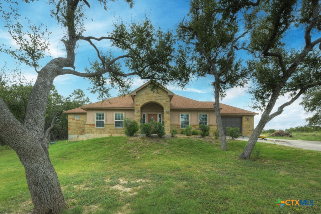 861 Rutherford Fischer, TX 78623 - Photo 1 of 38 Front elevation of property. Beautiful entrance with multiple mature oaks.