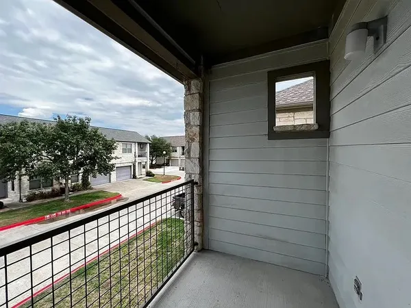 a balcony view with a street view