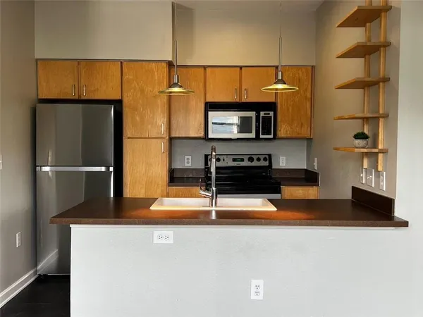a view of kitchen with furniture and wooden floor